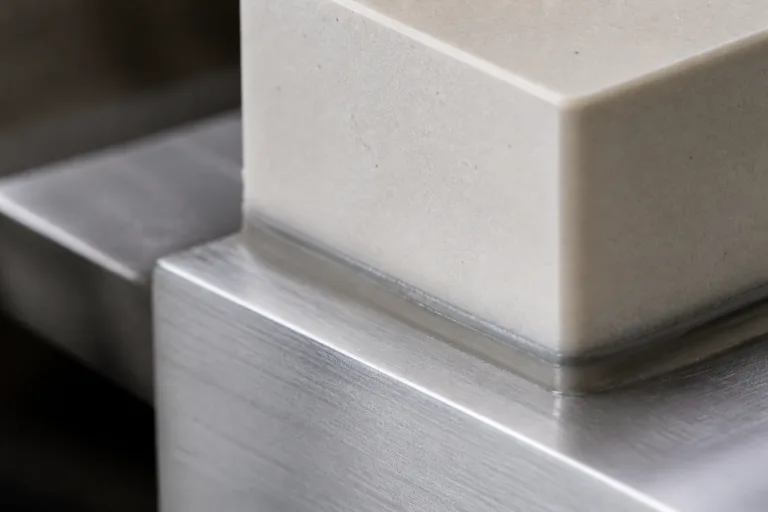 Ceramic Adhesive 15 A realistic close-up engineering scene showing ceramic adhesive selection for stress reduction and crack prevention through careful joint design and thermal expansion control.