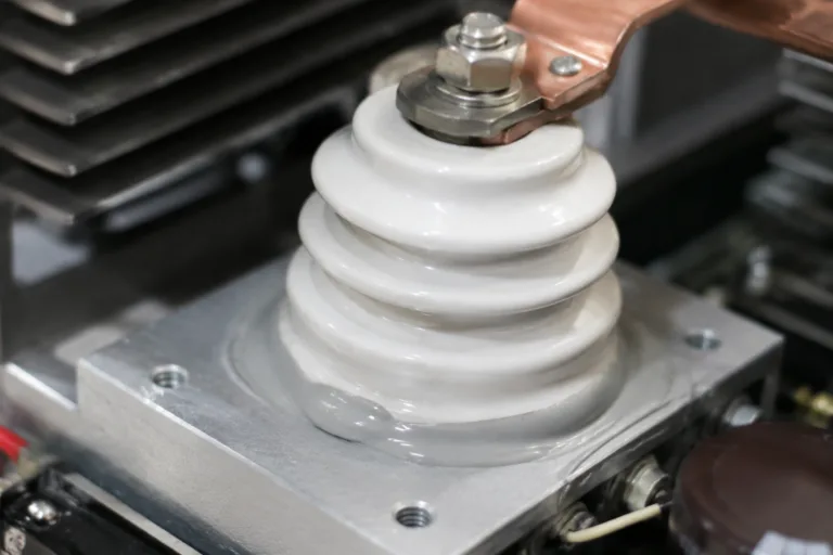 Ceramic Adhesive 7 A realistic close-up product shot of a ceramic insulating component attached with adhesive inside a clean electronic or power-related assembly, highlighting insulation, dielectric support, and precise component mounting.
