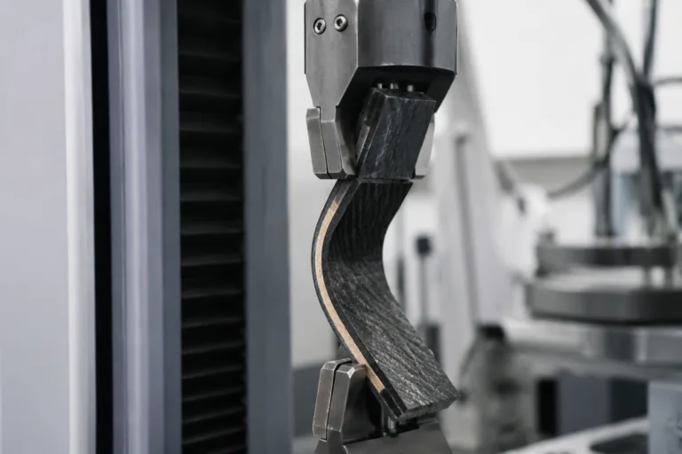 Composite Adhesive 13 Professional industrial close-up showing composite adhesive joints undergoing controlled peel and fatigue testing to demonstrate durable lightweight structure performance.