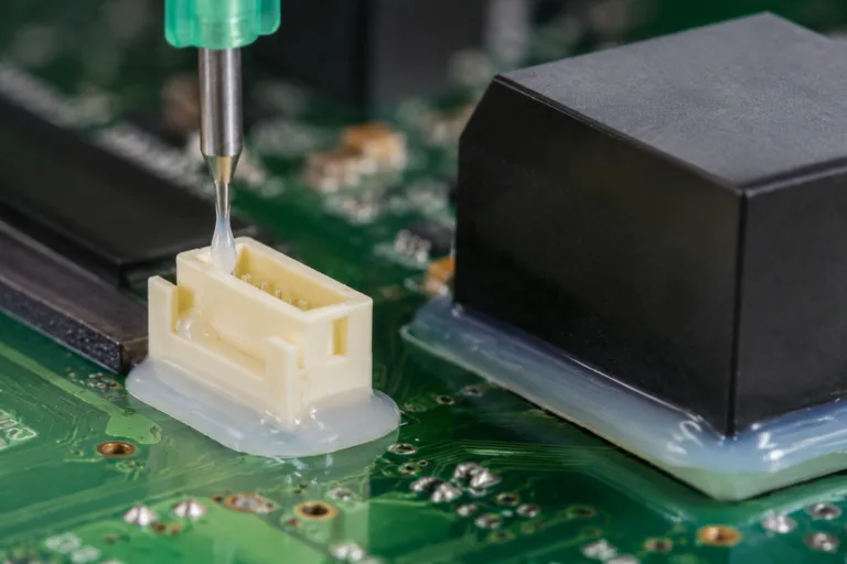 PCB Adhesive 6 A realistic close-up industrial product image showing connector reinforcement adhesive applied to support a PCB connector and reduce mechanical stress on mounted components.