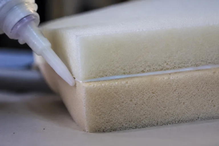 Foam Adhesive 3 A realistic industrial product shot showing foam-to-foam bonding with precise adhesive application, emphasizing the cushioning texture and clean assembly quality.
