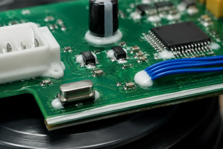 PCB Adhesive 4 A realistic close-up of a PCB demonstrating component fixing, staking, wire tacking, connector reinforcement, edge bonding, and local adhesive reinforcement in one professional manufacturing scene.
