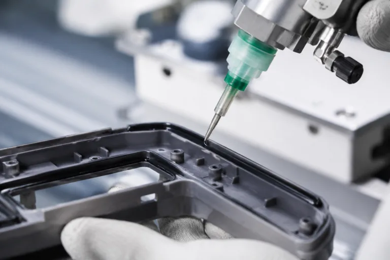Rubber Adhesive 5 A realistic industrial close-up showing adhesive bonding of rubber to plastic during a clean mixed-material product assembly.