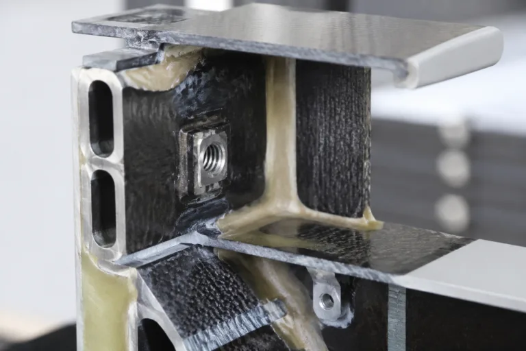 Composite Adhesive 12 A realistic professional product photography scene illustrating composite adhesive functions in a structural panel joint, including insert fixation, reinforcement bonding, and lightweight frame assembly.