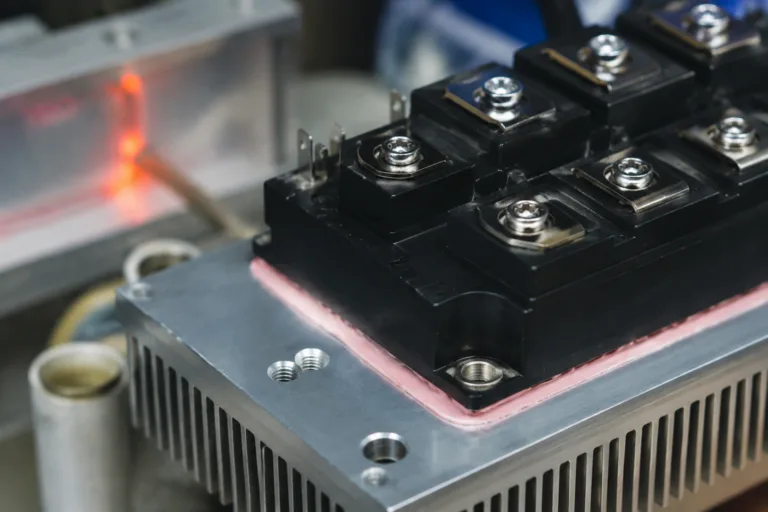 Insulation Adhesive 10 A realistic close-up industrial electronics image showing an insulated electronic module or power device with heat management considerations, highlighting thermal resistance, thermal cycling, and insulation adhesive selection concepts.