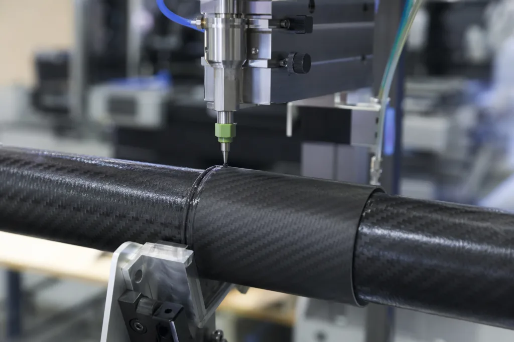 Carbon Fiber-to-Carbon Fiber Adhesive Bonding: How to Build Strong CFRP Joints Without Creating Peel Failure 2 carbon fiber adhesive dispensing cfrp assembly
